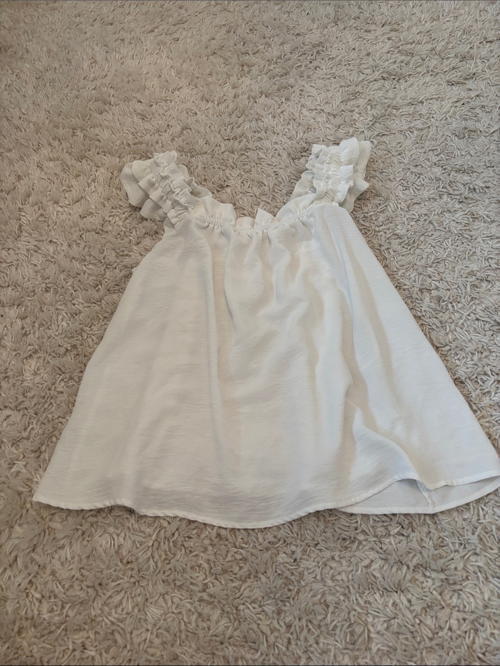 White flowy top